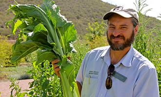 Educator Jesus with native plant